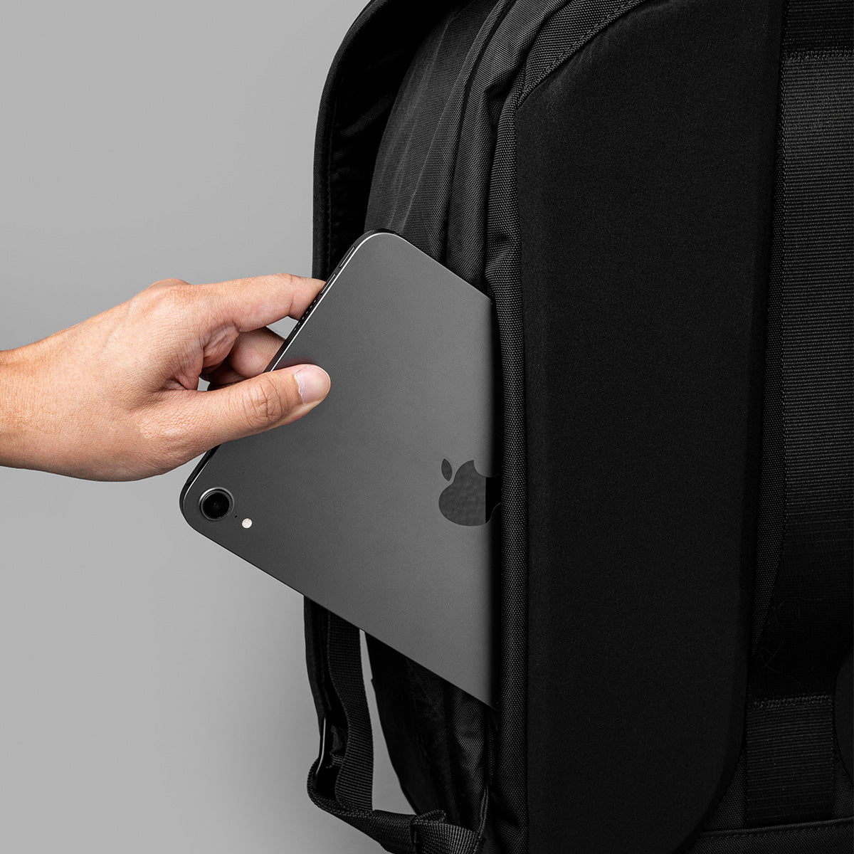 Discreet side pocket being used for a tablet