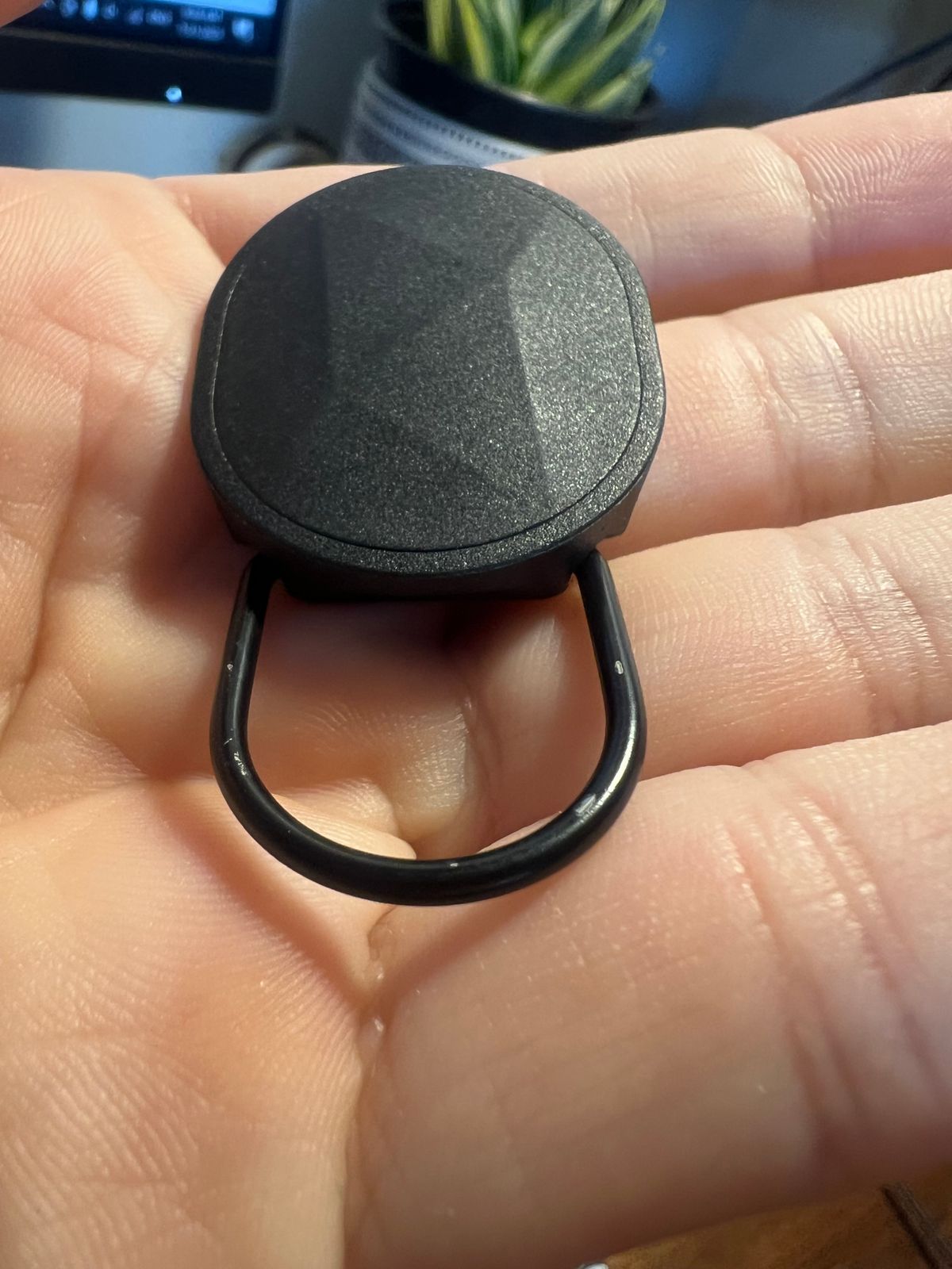 Customer close-up of key-tether finish wear, view one