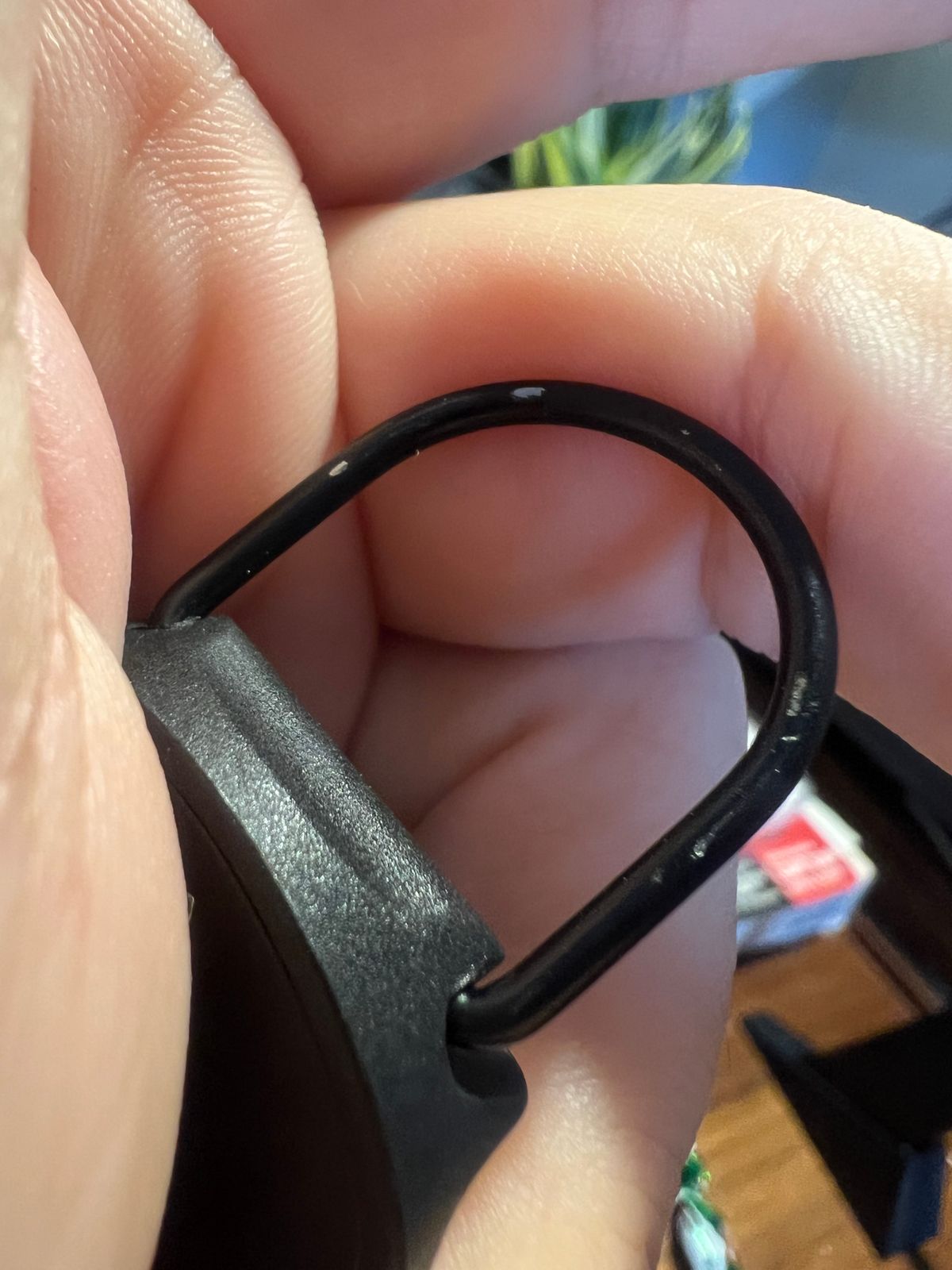 Customer close-up of key-tether finish wear, view two