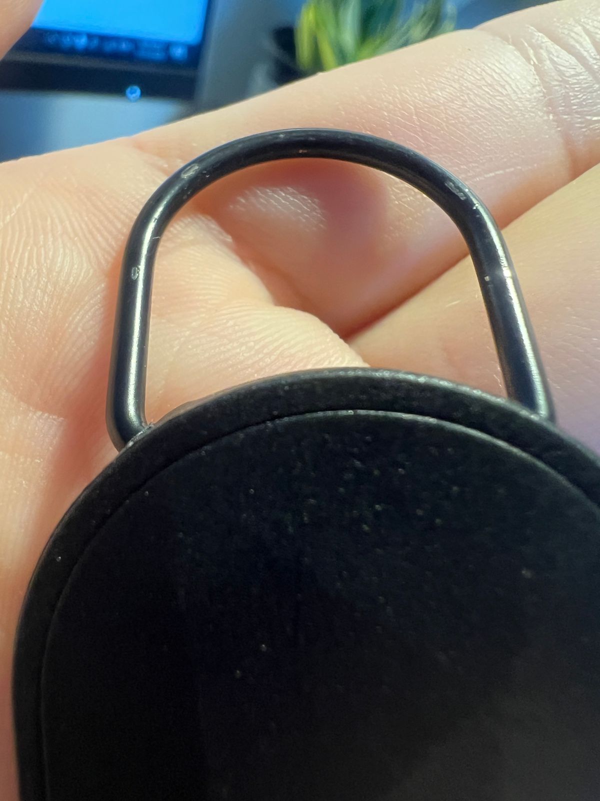 Customer close-up of key-tether finish wear, view four